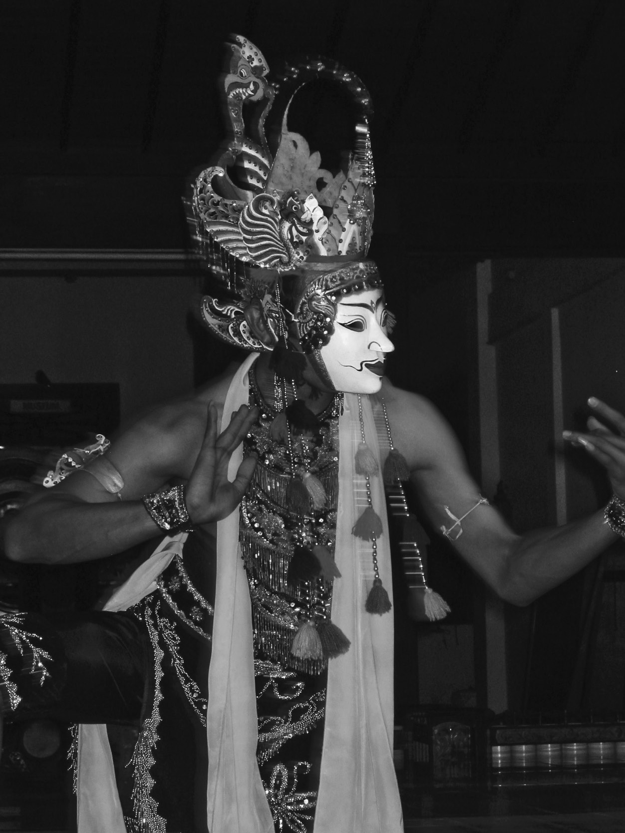 A dancer performs the masked dance Gunung Sari. The dancer is in a kneeling position, but the lower arm position and smaller movement volume compared to Klana in Figure 6 can be seen. Photograph by Mr. Sunardi, 2006.