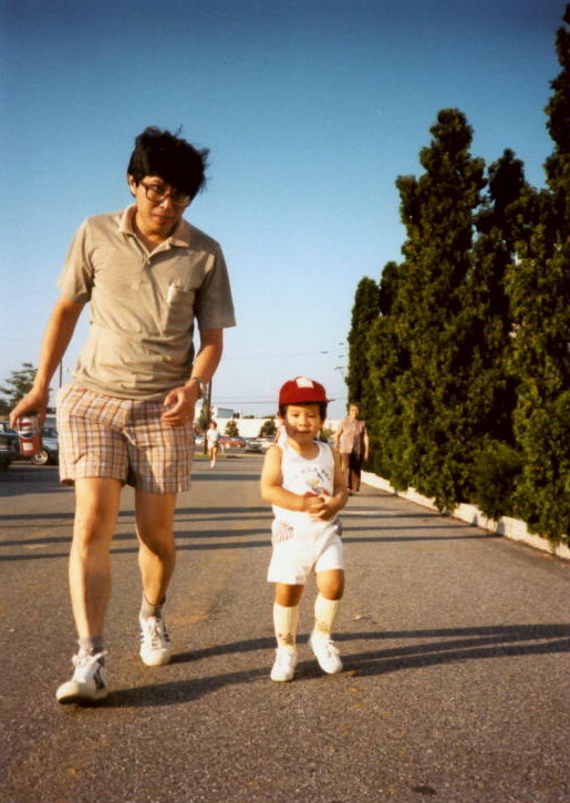 Wei-Min Huang and Son Running in the Park